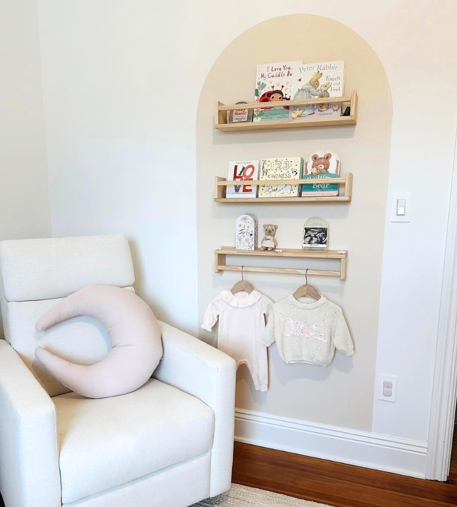 Photo of a Bohemian nursery accent wall with 2 bookshelves and a shelf