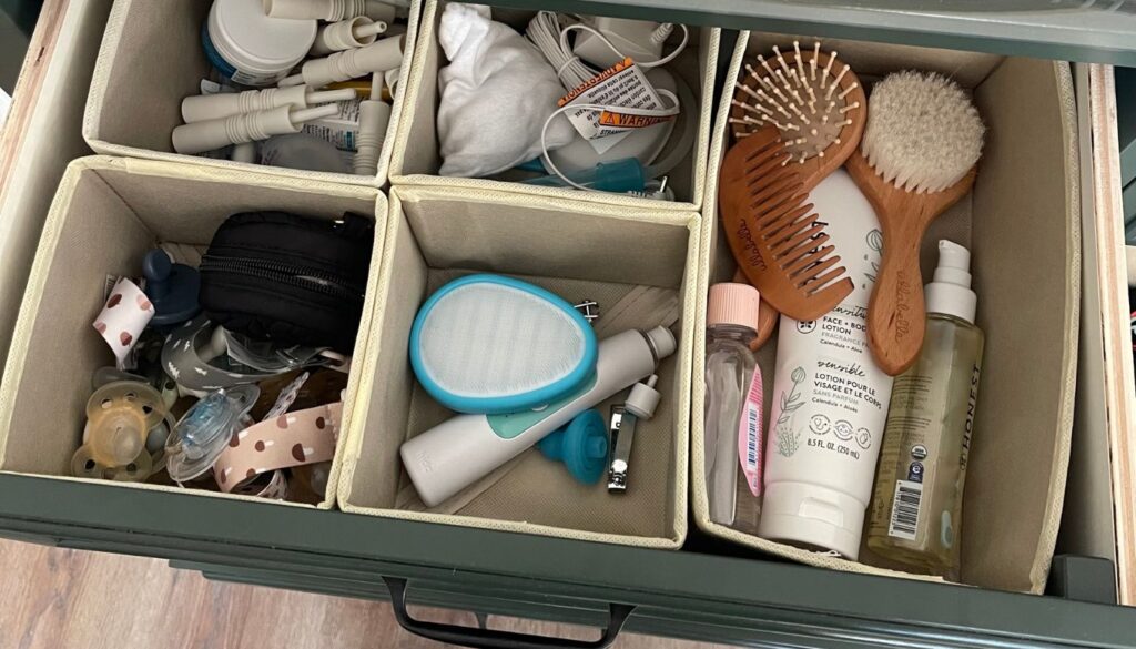 Photo of a drawer with baby care items like brushes, pacifiers