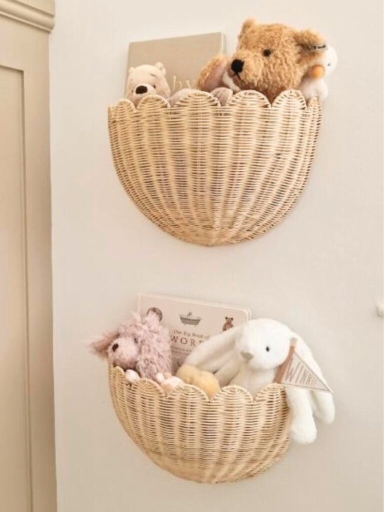Two wall baskets with stuffed animals in them