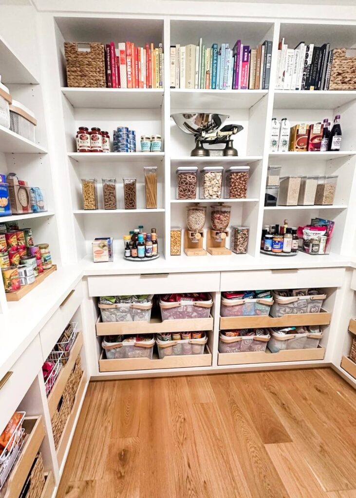 Organized white pantry organized by zones.