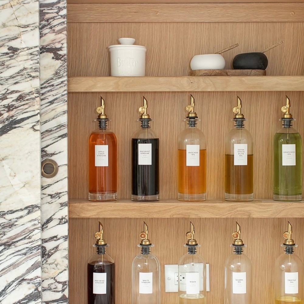 A visible pantry with oils in oil dispensers