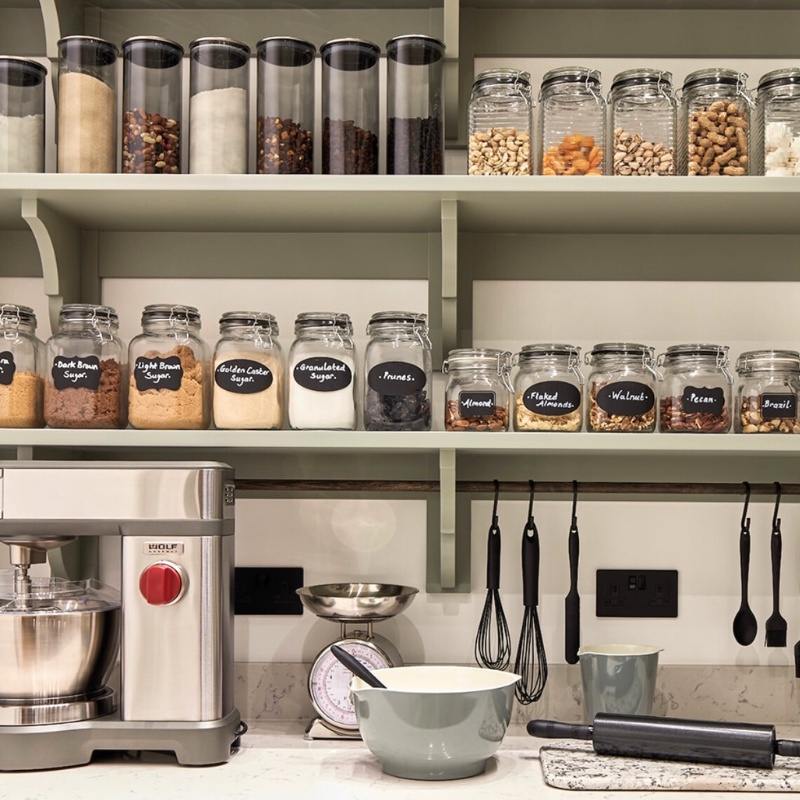 Large Pantry that has shelving and pantry items organized in jars.