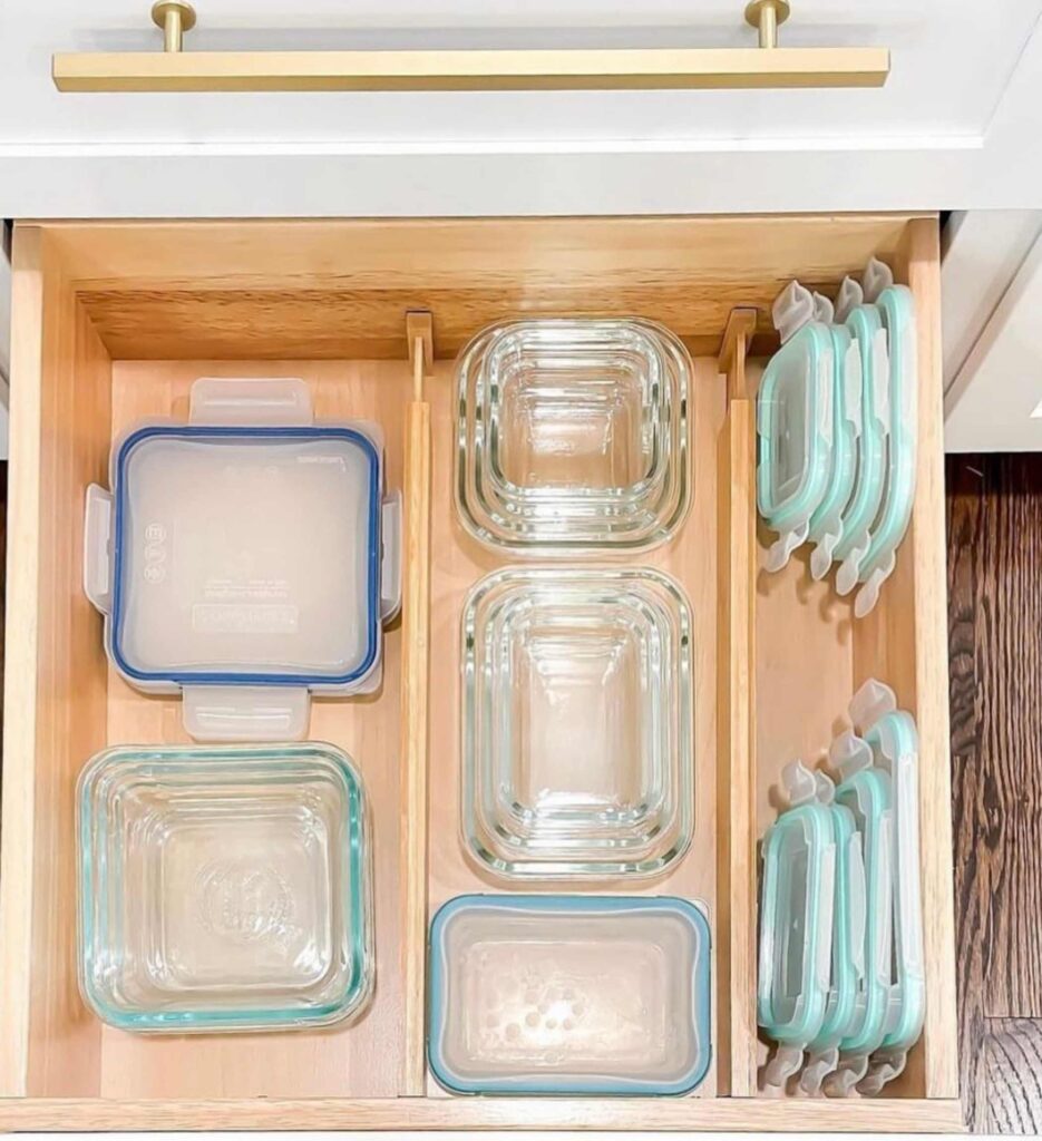 Where to put things in kitchen cabinets and drawers: meal prep containers stored in it. 