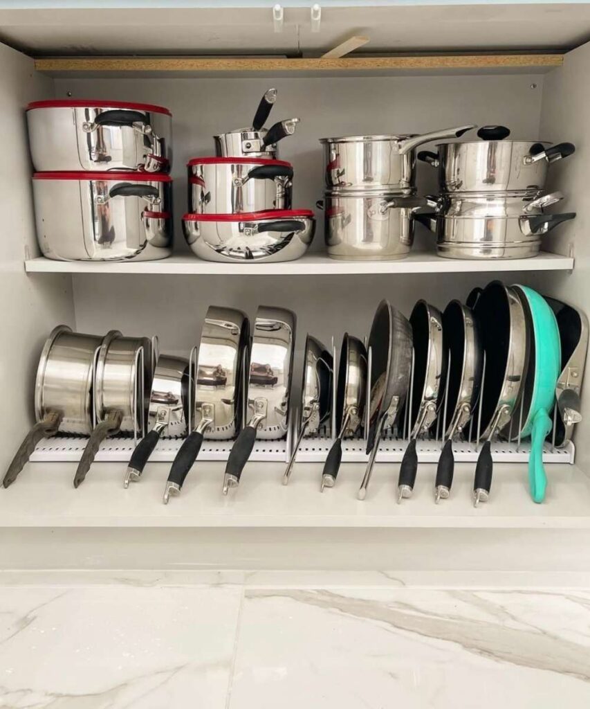 Where to put things in kitchen cabinets and drawers: Pots and pans organized on cabinet shelves 