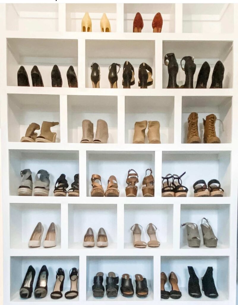 Storage ideas for closets: Heels stored on a cubby wall in a large closet 