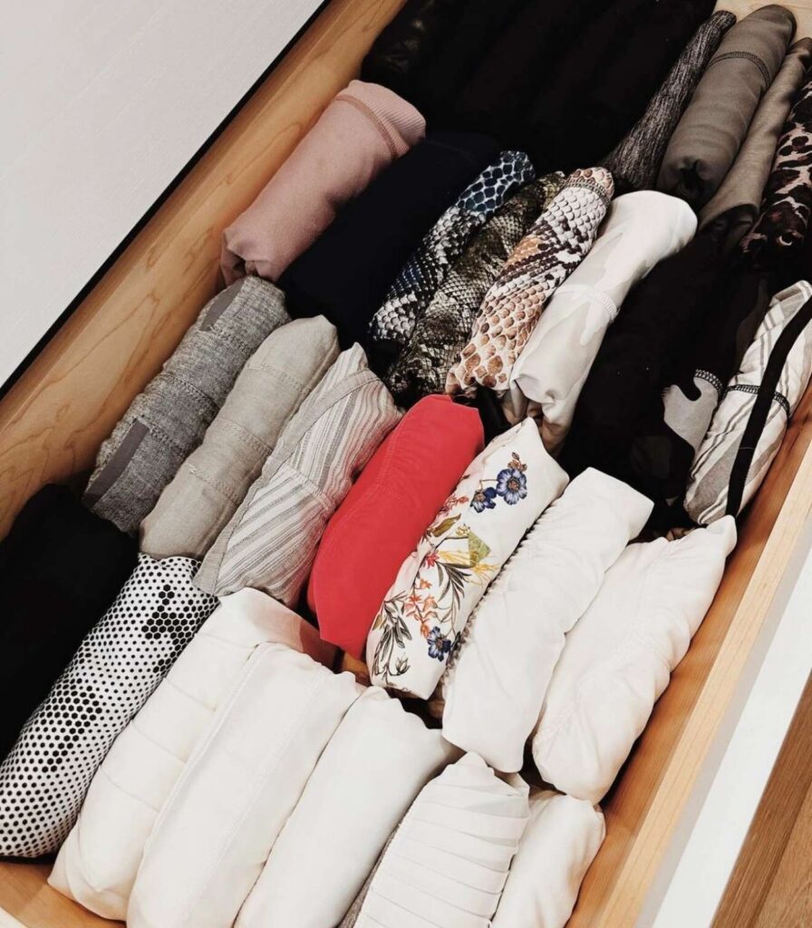Picture of a bedroom dresser drawer with clothes folded using the file method