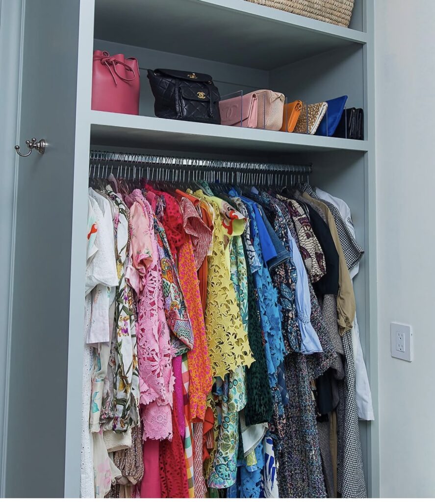 How to organize your bedroom closet by color coordinating your clothes.