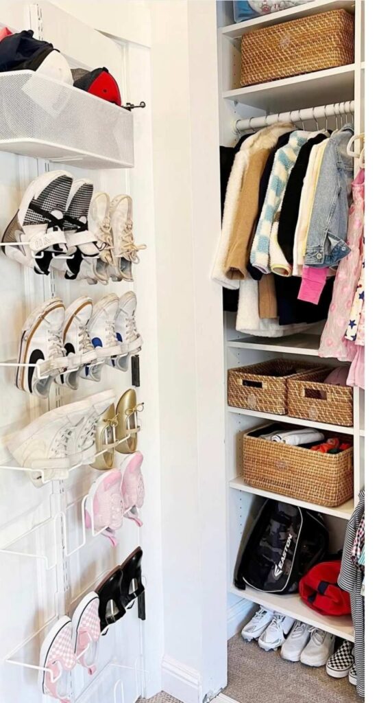 Shoes stored on a wire rack on the back of a closet door 
