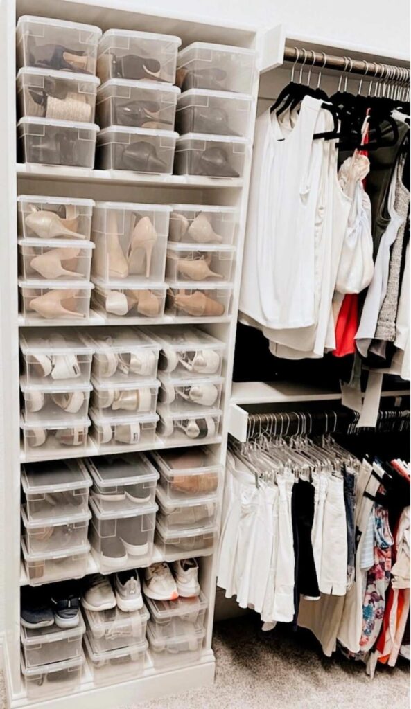 Shoes organized in shoe boxes on closet shelves 