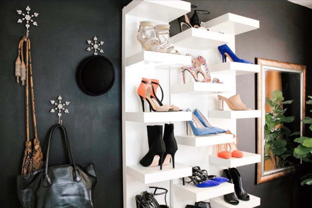 Shoes organized as a display on display shelving