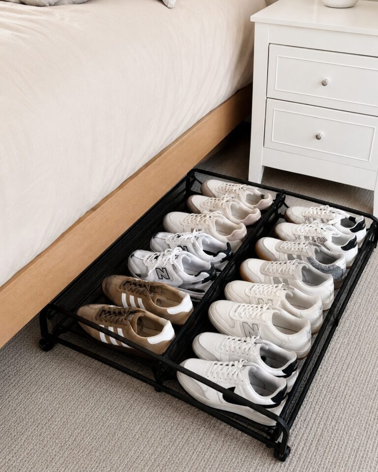 Shoes being stored under the bed using a rolling shoe rack