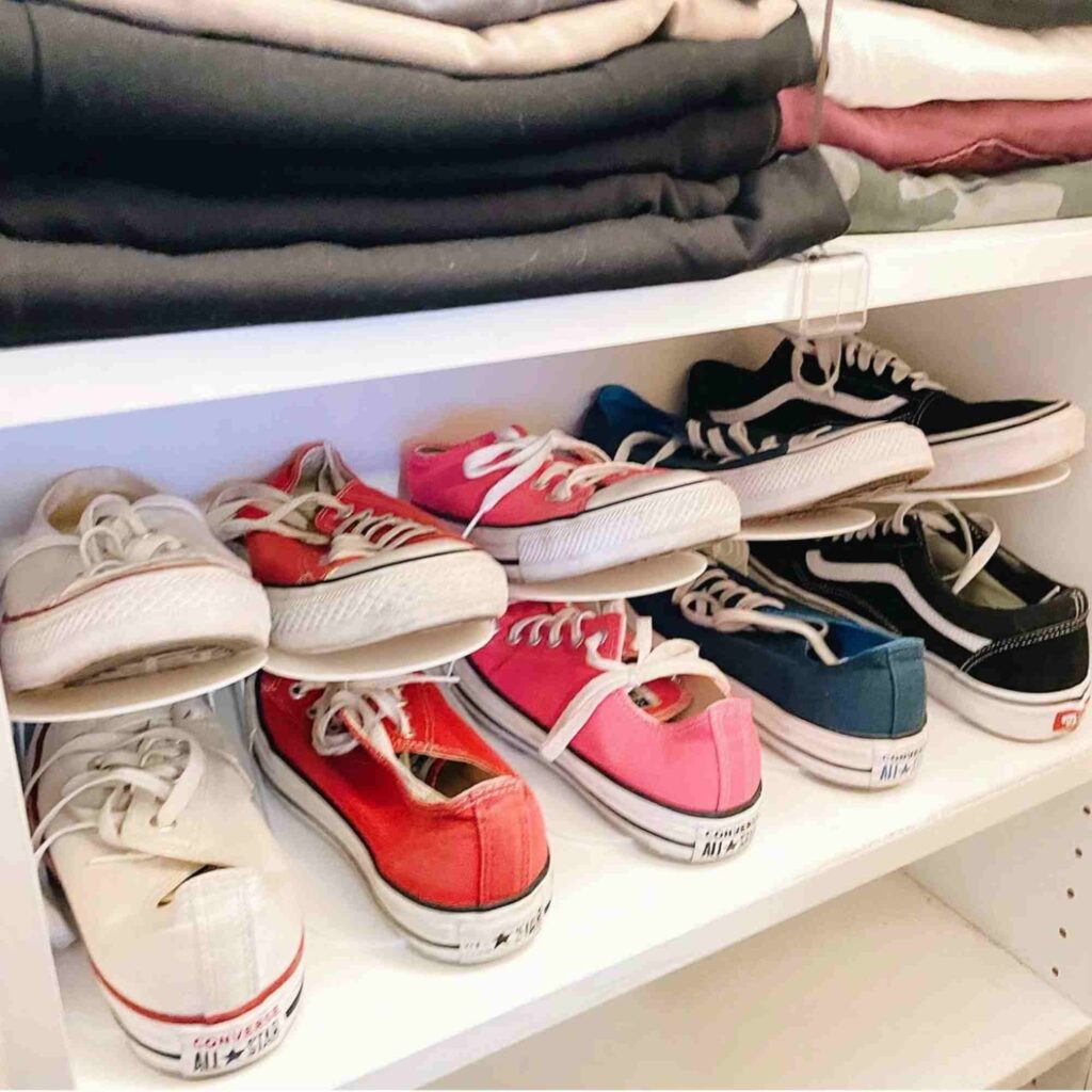 Converse sneakers organized in shoe slot organizers facing out 