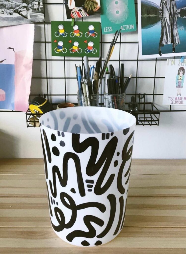 A garbage can on a desk 