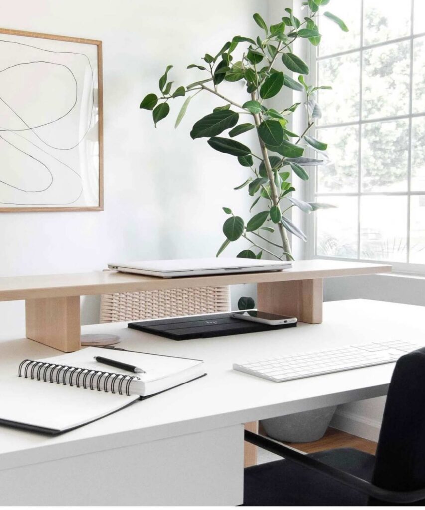 Picture of a desk with a built in shelf on top of the desk 
