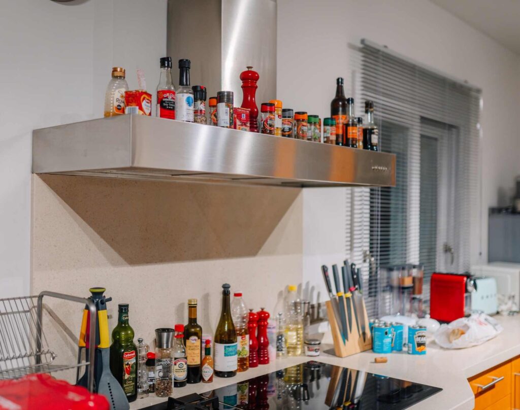 Cluttered kitchen counters with everyday used items. 