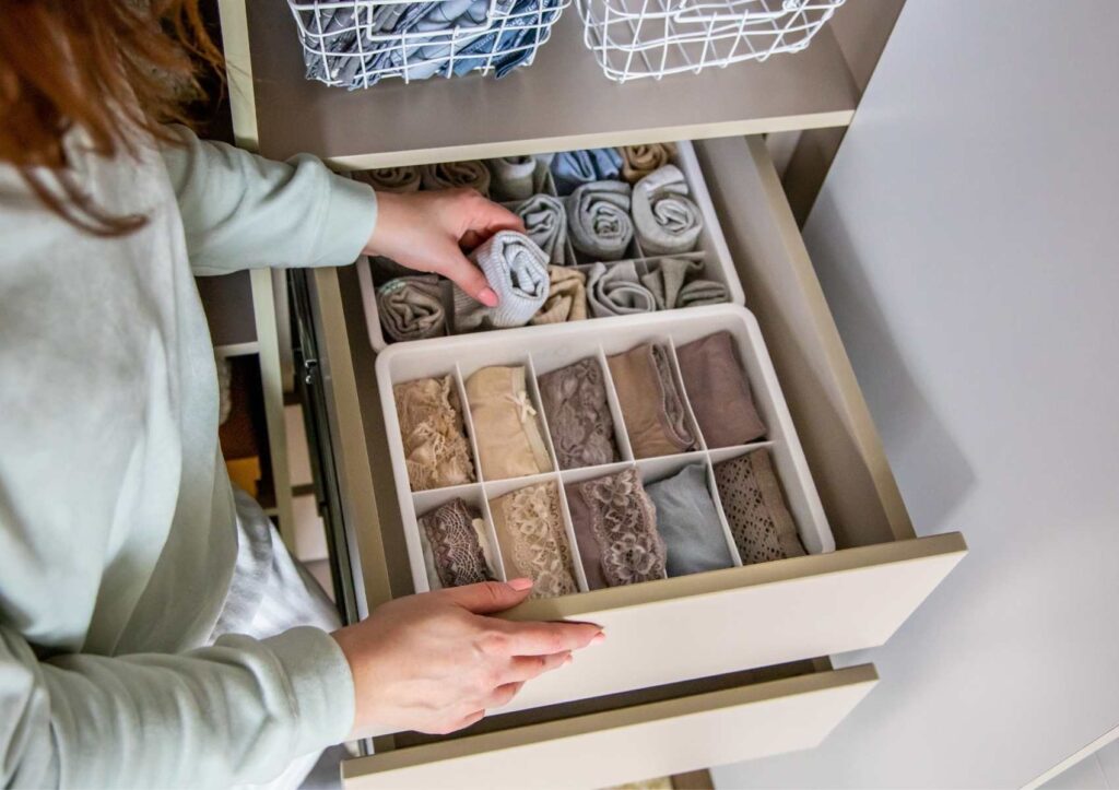 How to organize a room using an organizer: Picture of bedroom dresser drawer with drawer organizers