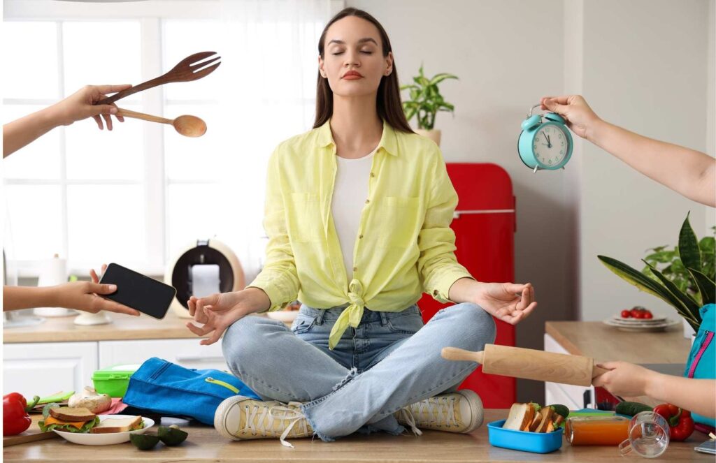 woman meditating on kitchen counter 