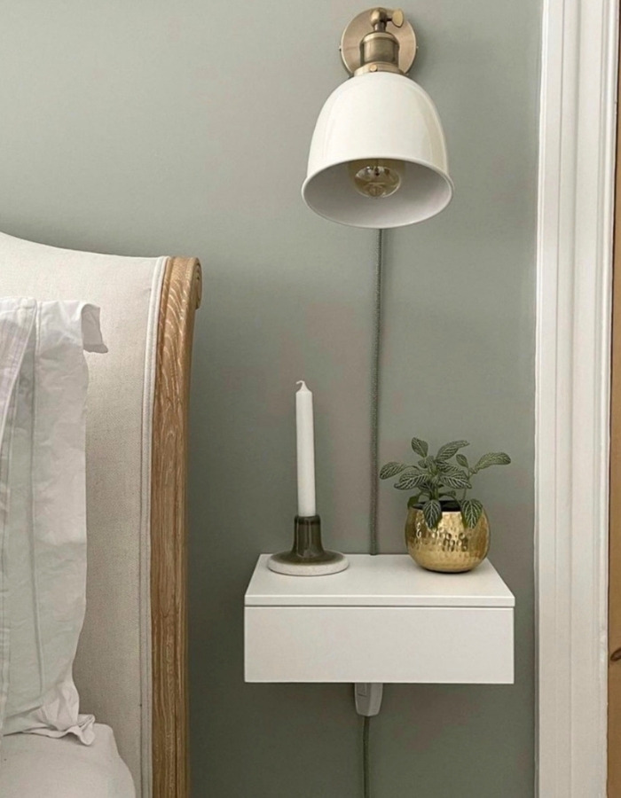 Small bedroom storage ideas: A white light hanging on the wall. 